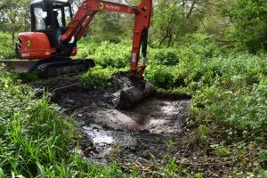 Digger scraping out the Sping path pond